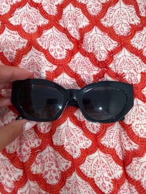 Versace women’s black thick sunglasses with gold and rhinestone embellishments